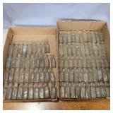 2 flats of small glass bottles 2 3/4in