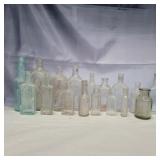 17 glass bottles various sizes