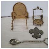 Cast iron holder, brass tea cup and plate holder,