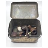Old tin of tobacco pipes, pieces