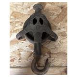 Old cast iron barn pulley and hook marked 196
