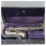 Pan-American saxophone in a conn case