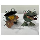 Handcrafted metal frog figurines playing