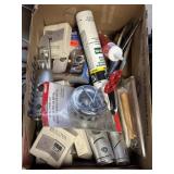 variety of hardware, tools, caulk, metal strap