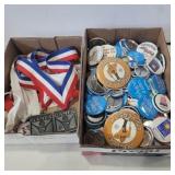 Assorted buttons and senior games medals
