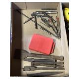 variety of loose drill bits, chisels, and other