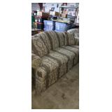 Re-upholstered tan floral pattern couch with