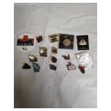 Group of assorted souvenir pins.