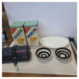 Crackers tin, alarm clock, platter and 2 bowls