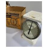 white metal kitchen scale made by the American