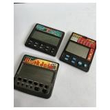 Two blackjack handheld electronic games and one