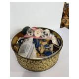 Tin of sewing items