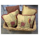 Wicker laundry basket with four throw pillows