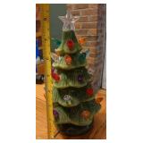 9in tall ceramic Christmas tree. Not lighted.
