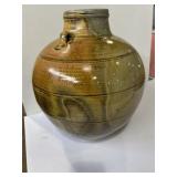 studio pottery vase featuring a golden rust and