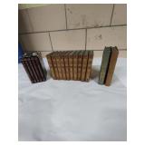 Three sets of vintage books.