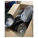 Kitchen items, including pots, pans, pitchers,