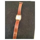 Gitano gold tone watch with leather band