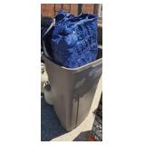 Tarp and trash can with lid