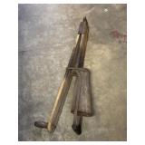 antique wooden and metal hand-held corn planter