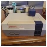 Old school nintendo with power cord and super