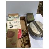 Boy Scout handbooks, mess tin, first aid kit, and