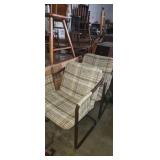 2 matching metal frame chairs
