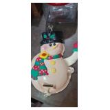 Solar powered waving snowman window decoration
