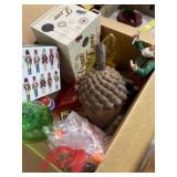 Christmas decor, including elf statue, light