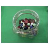 Glass Canister of Marbles and Garden Glass