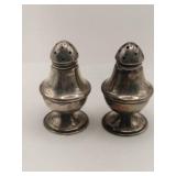 Silver salt and pepper shakers Marked Sterling.