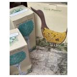 Outdoor duck planner and two glass candleholders