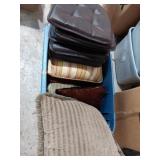 Decorative pillows and six brown seat cushions in