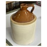 Two-toned vintage stoneware whiskey jug, has a
