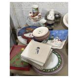 Mix of Christmas serving decor, plates, candles