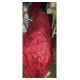 Large christmass tree in bag with stand