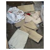 Clean linen tablecloths, one has stitched design