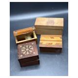 Small wooden boxes, one with trinkets
