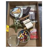 Marbles, magnifier, novelty toilet paper roll,