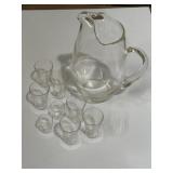 large clear glass pitcher and matching glasses
