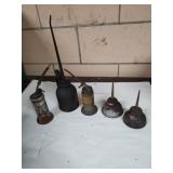Group of vintage oil cans.