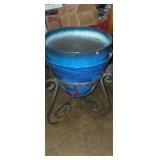 Wrought iron planter stand with plastic pots