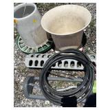 Chicken feeders, flower pot, yard sprinkler, and