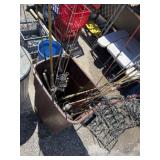 Fishing poles and reels in plastic waste bin