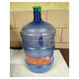 Empty Primo 18.9L/5 gallon water jug.
