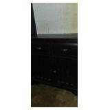 black accent cabinet with drawers above two doors