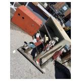 Metal cabinet, homemade wooden animal enclosure,