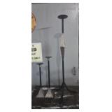 3 staggered metal candle stands