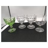Four buying glasses, three clear one green