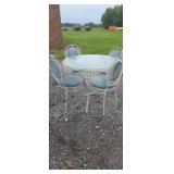 Ornate wrought iron glass top patio table with 4